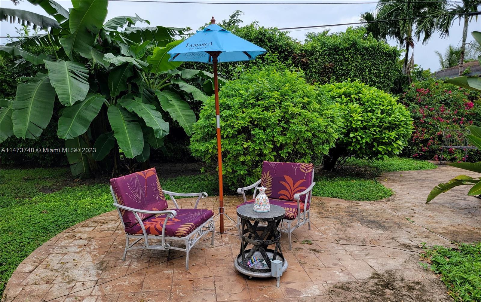 Olympia Heights Miami, FL 33165 - Photo 33 of 45 an outdoor sitting area with furniture and garden