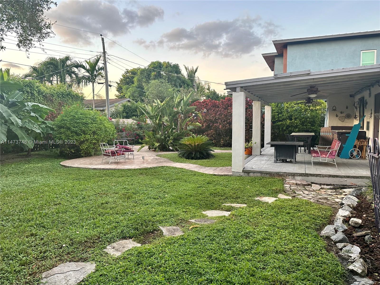 Olympia Heights Miami, FL 33165 - Photo 41 of 45 a view of a chair and tables in the garden
