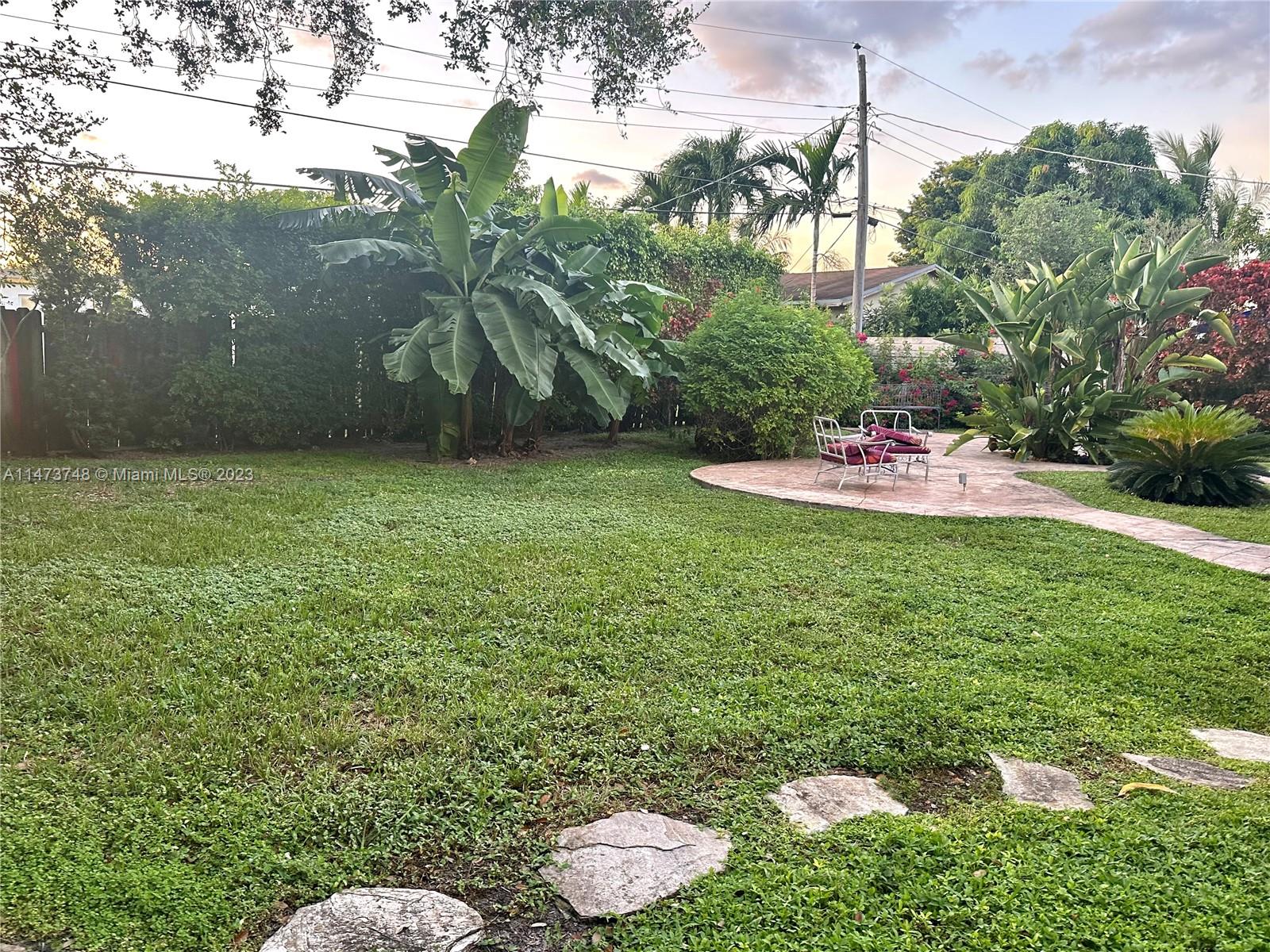 Olympia Heights Miami, FL 33165 - Photo 42 of 45 a view of a backyard with plants and a garden