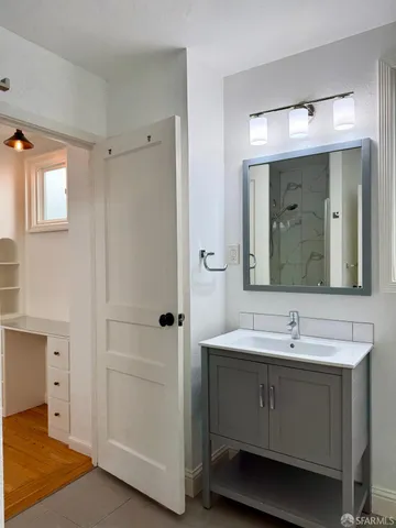 a bathroom with a sink and a mirror