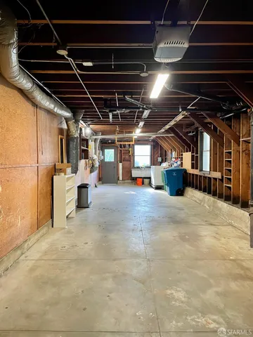 a view of empty room with wooden ceiling