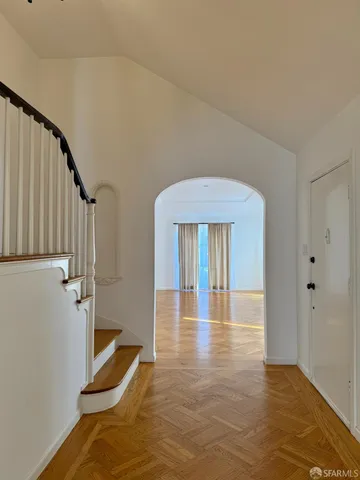 a view of a hallway with staircase