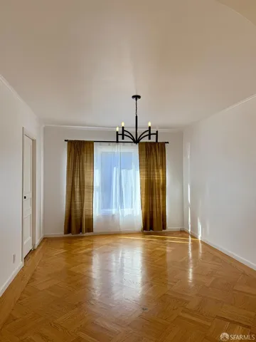 a view of a livingroom with wooden floor