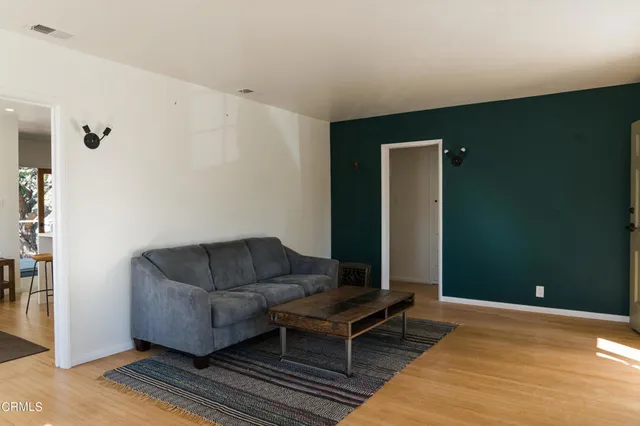 a living room with furniture and a rug
