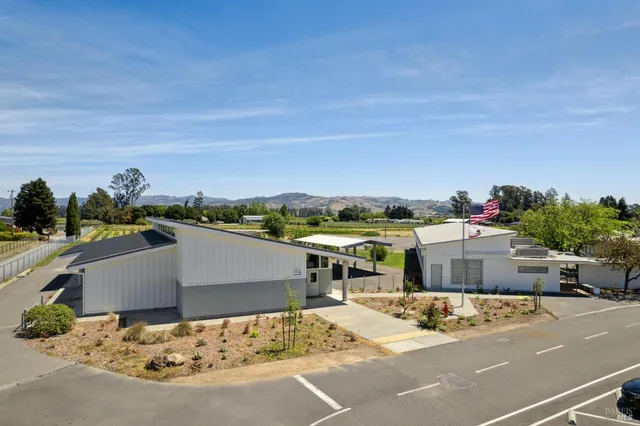 an aerial view of a house with a yard