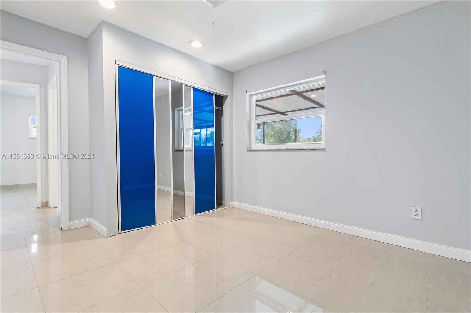10680 Ember Street Boca Raton, FL 33428 - Photo 11 of 19 a view of an empty room with window and closet