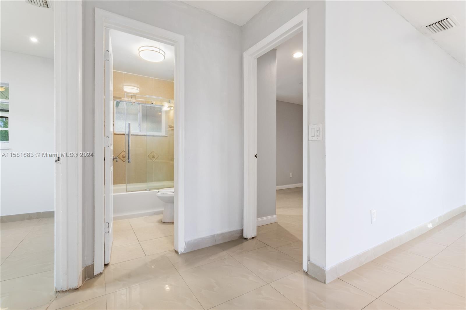 10680 Ember Street Boca Raton, FL 33428 - Photo 14 of 19 a view of an empty room and closet area