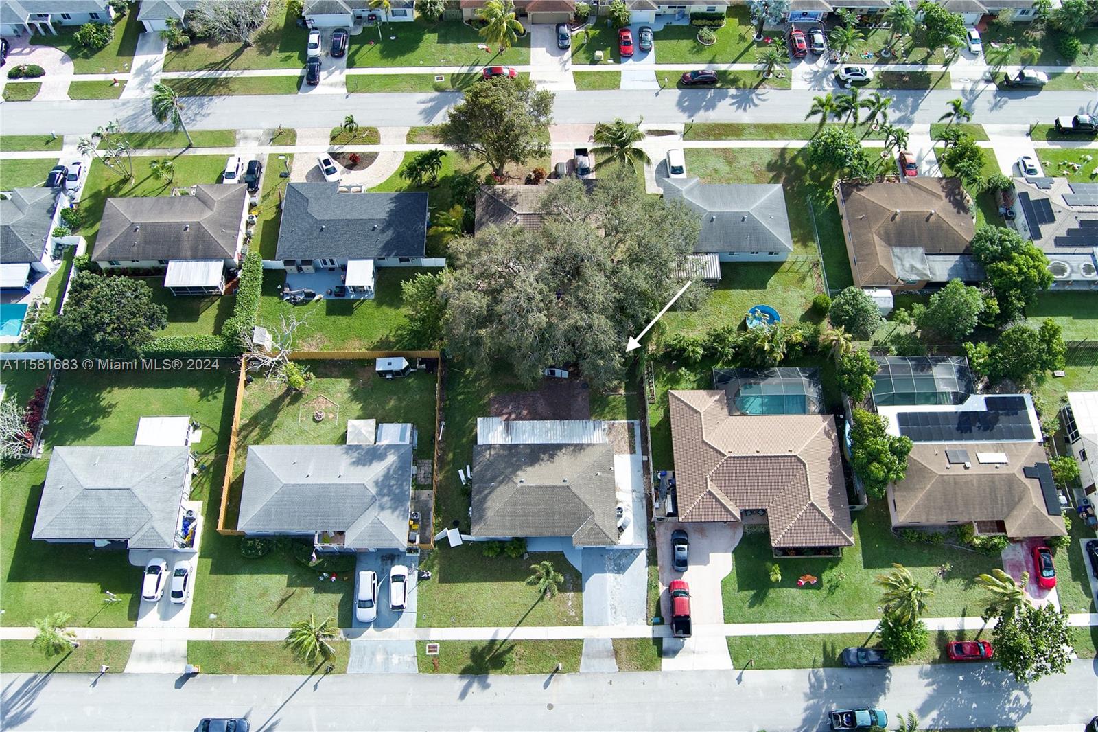 10680 Ember Street Boca Raton, FL 33428 - Photo 16 of 19 an aerial view of houses with yard