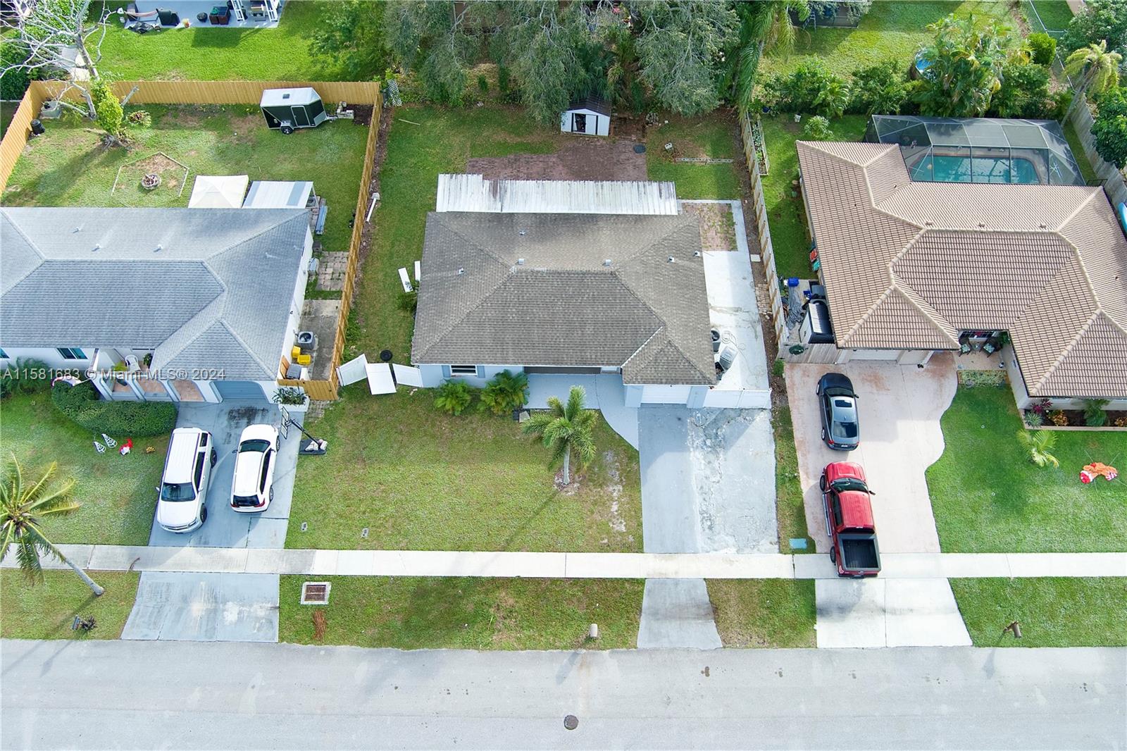 10680 Ember Street Boca Raton, FL 33428 - Photo 17 of 19 an aerial view of multiple houses with outdoor space