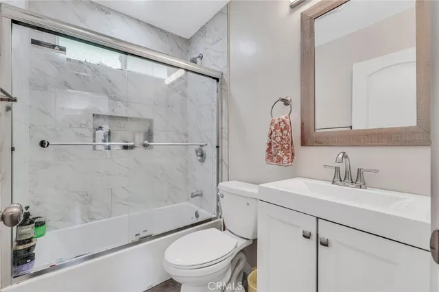 a kitchen with stainless steel appliances granite countertop a refrigerator stove and sink