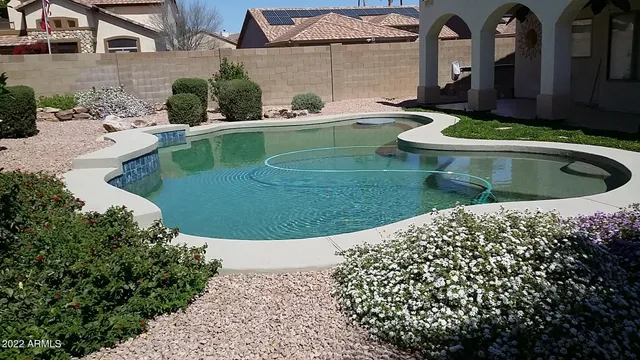 a view of a swimming pool with a patio