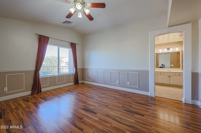 a bathroom with a double vanity sink mirror and bathtub