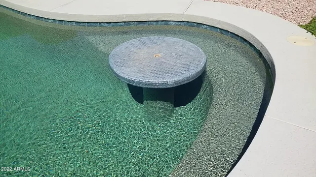 a kitchen with a sink and a stove top oven