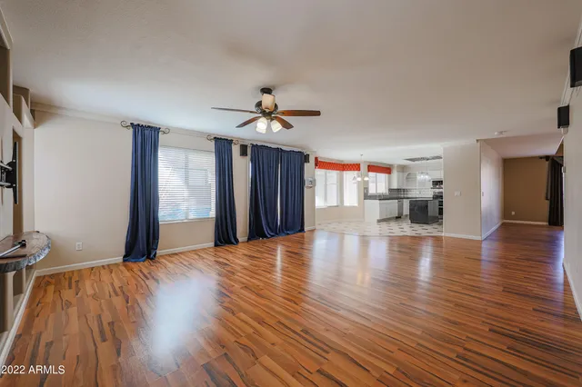 a kitchen with a sink stainless steel appliances a counter space and a window