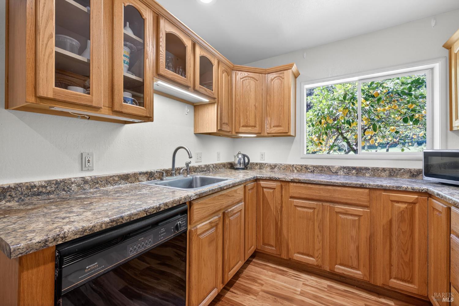 3320 Redwood Road Napa, CA 94558 - Photo 40 of 57 a kitchen with stainless steel appliances granite countertop a sink and cabinets