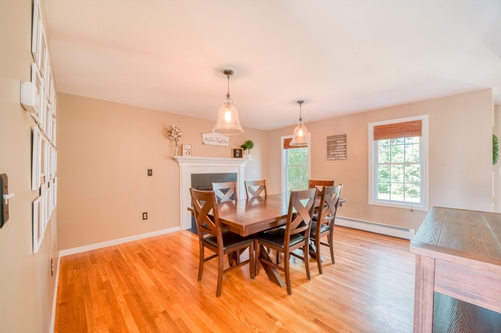 46 Brookline Street Pepperell, MA 01463 - Photo 13 of 41 a view of a dining room with furniture and wooden floor