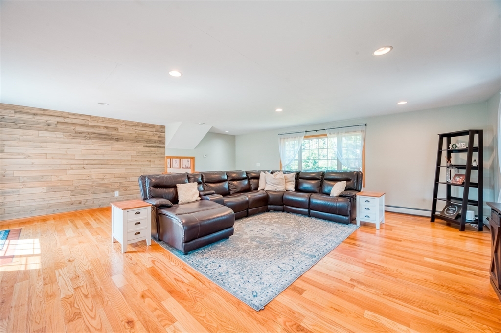 46 Brookline Street Pepperell, MA 01463 - Photo 17 of 41 a living room with furniture and a wooden floor