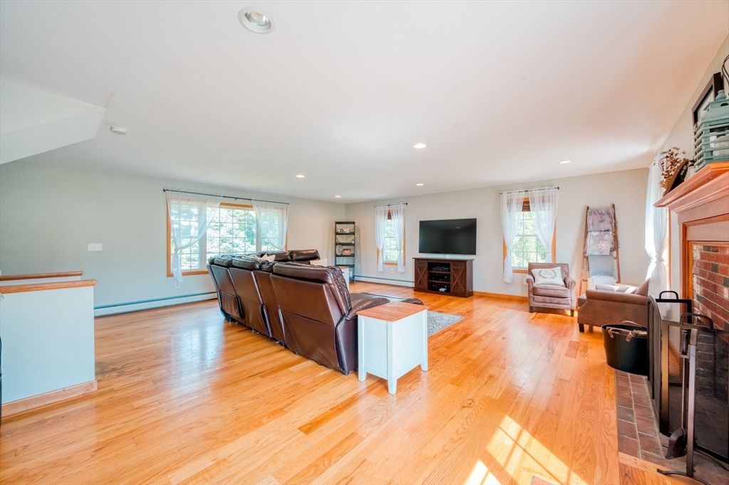 46 Brookline Street Pepperell, MA 01463 - Photo 18 of 41 a living room with furniture and a flat screen tv