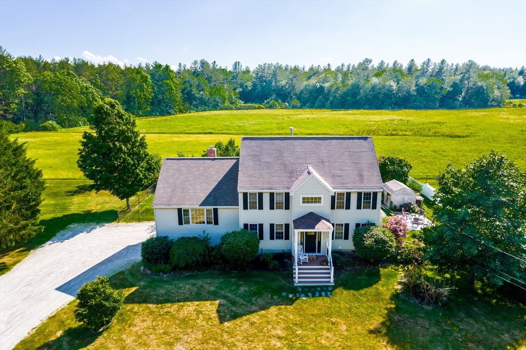 46 Brookline Street Pepperell, MA 01463 - Photo 2 of 41 a view of a house with a yard and a large tree