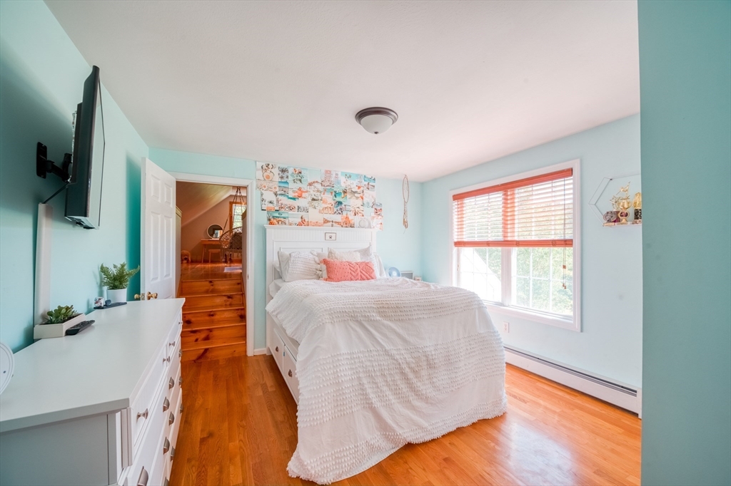 46 Brookline Street Pepperell, MA 01463 - Photo 26 of 41 a living room with furniture and a flat screen tv
