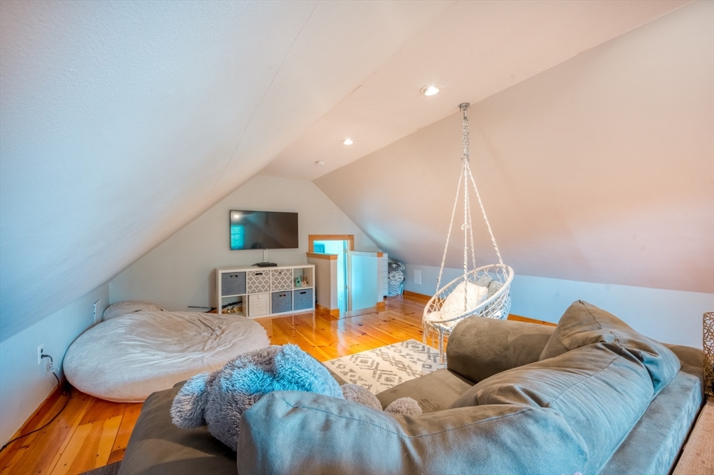 46 Brookline Street Pepperell, MA 01463 - Photo 30 of 41 a living room with furniture and a flat screen tv