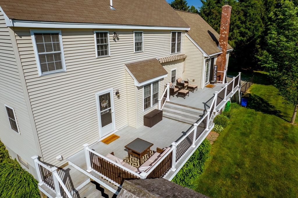 46 Brookline Street Pepperell, MA 01463 - Photo 39 of 41 a view of a patio with table and chairs and potted plants