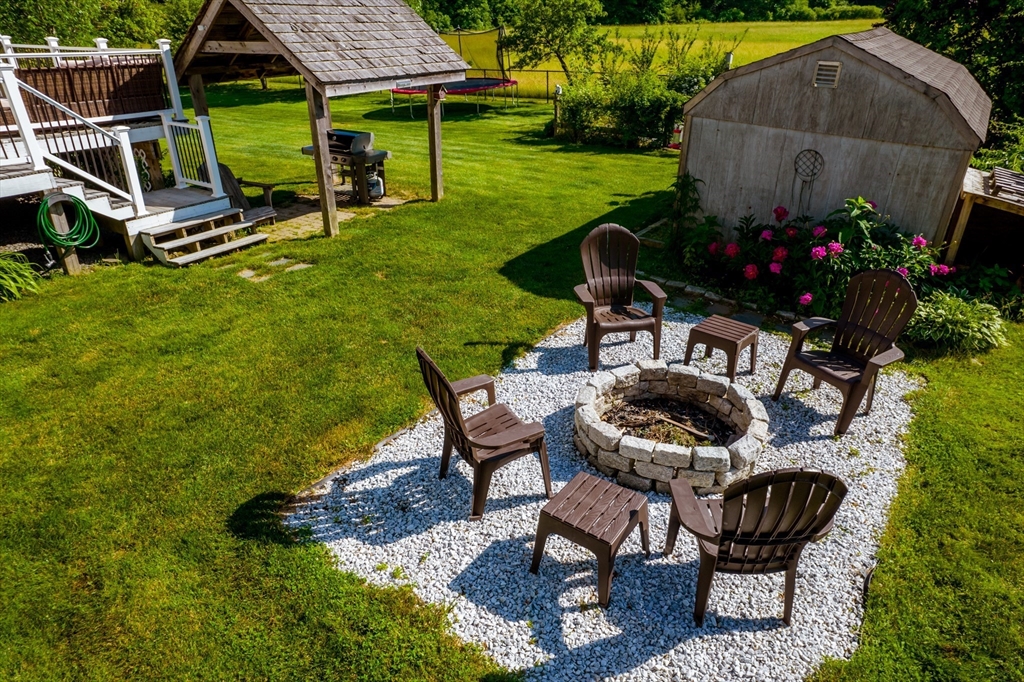 46 Brookline Street Pepperell, MA 01463 - Photo 40 of 41 a house view with a seating space and garden