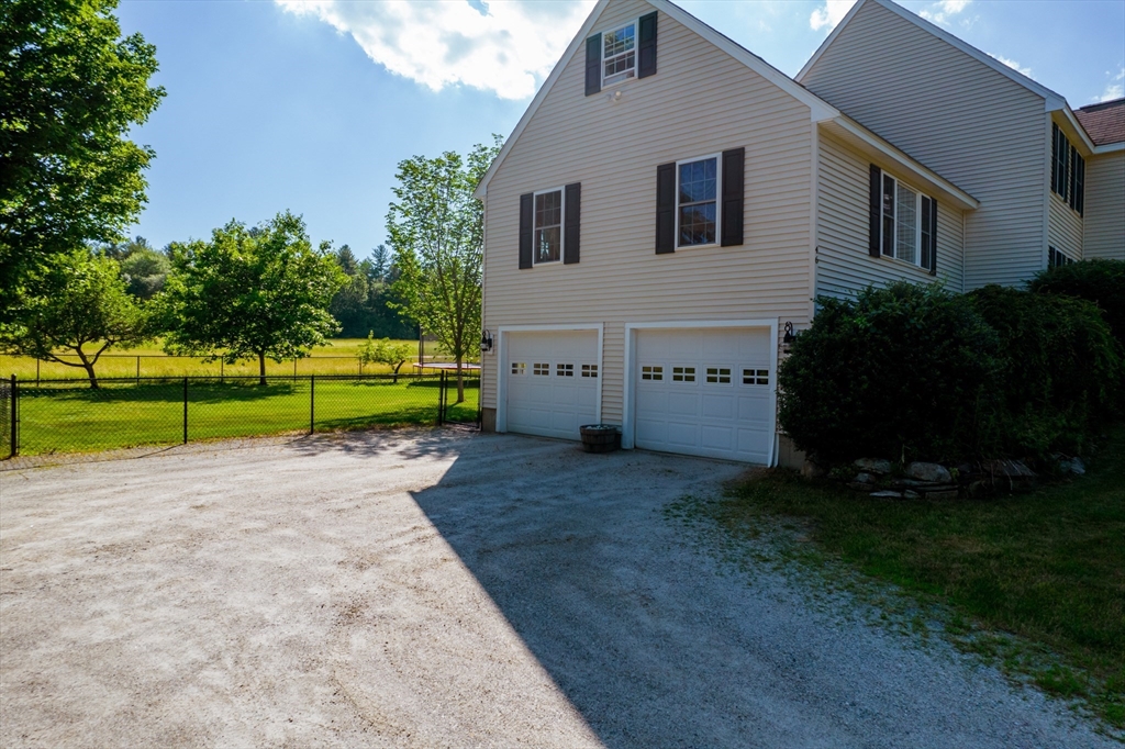 46 Brookline Street Pepperell, MA 01463 - Photo 4 of 41 a house view with a garden space