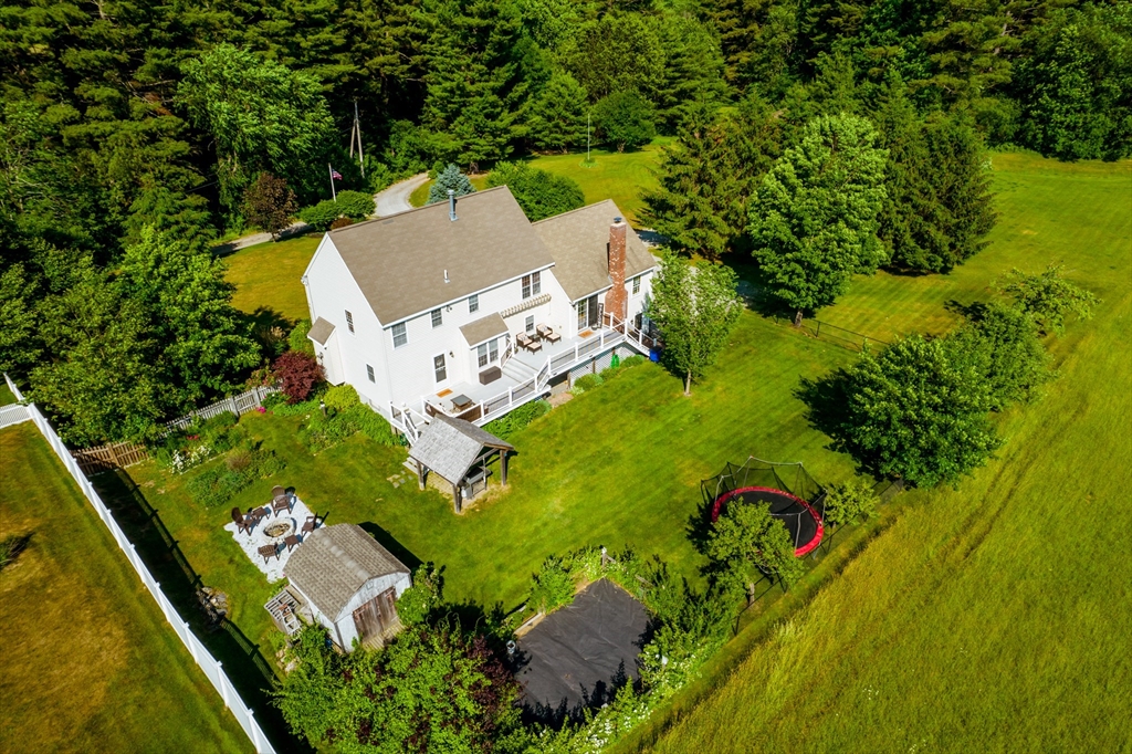 46 Brookline Street Pepperell, MA 01463 - Photo 41 of 41 an aerial view of a house with a yard