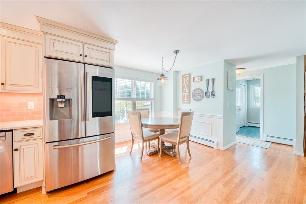 46 Brookline Street Pepperell, MA 01463 - Photo 6 of 41 a kitchen with stainless steel appliances a refrigerator and wooden floor