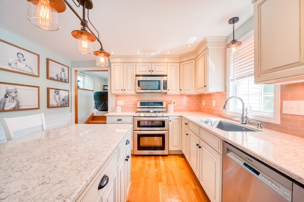 46 Brookline Street Pepperell, MA 01463 - Photo 10 of 41 a kitchen with stainless steel appliances granite countertop a stove and a sink