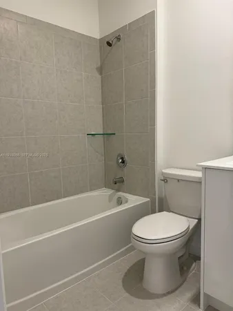 a view of a livingroom with an empty space and a window