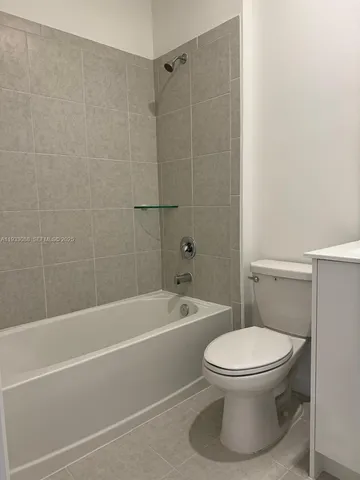 a view of a livingroom with an empty space and a window