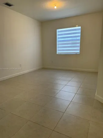 a kitchen with a refrigerator sink and microwave