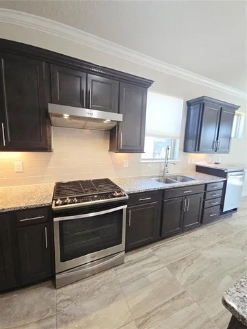 a kitchen with a stove and a microwave