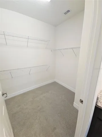 a view of a room with racks on the wall