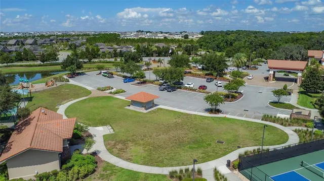 an aerial view of a house with outdoor space and a swimming pool