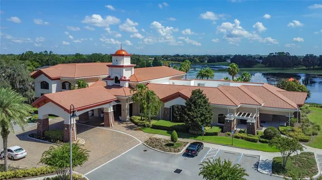 an aerial view of a house with swimming pool yard and outdoor seating