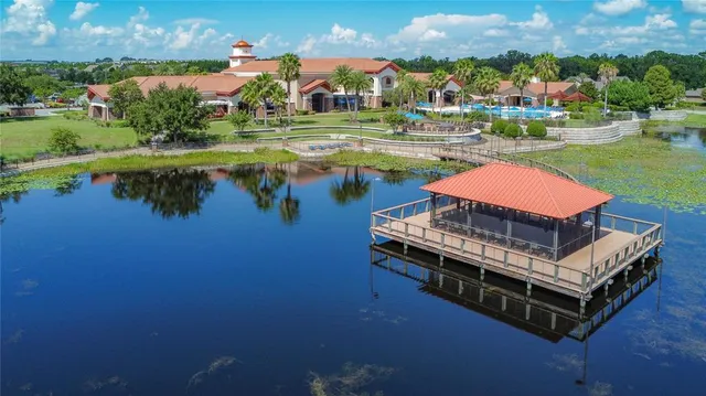 an aerial view of a house with a lake view