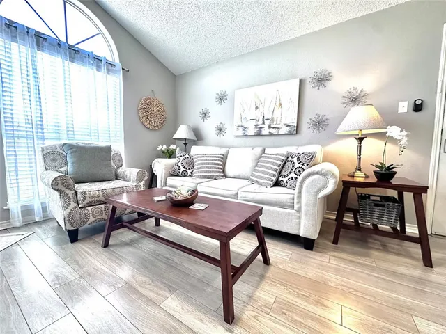 a living room with furniture and a table