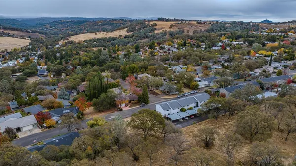 an aerial view of residential house with outdoor space