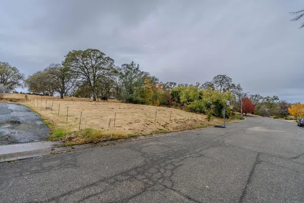 a view of a road with a yard