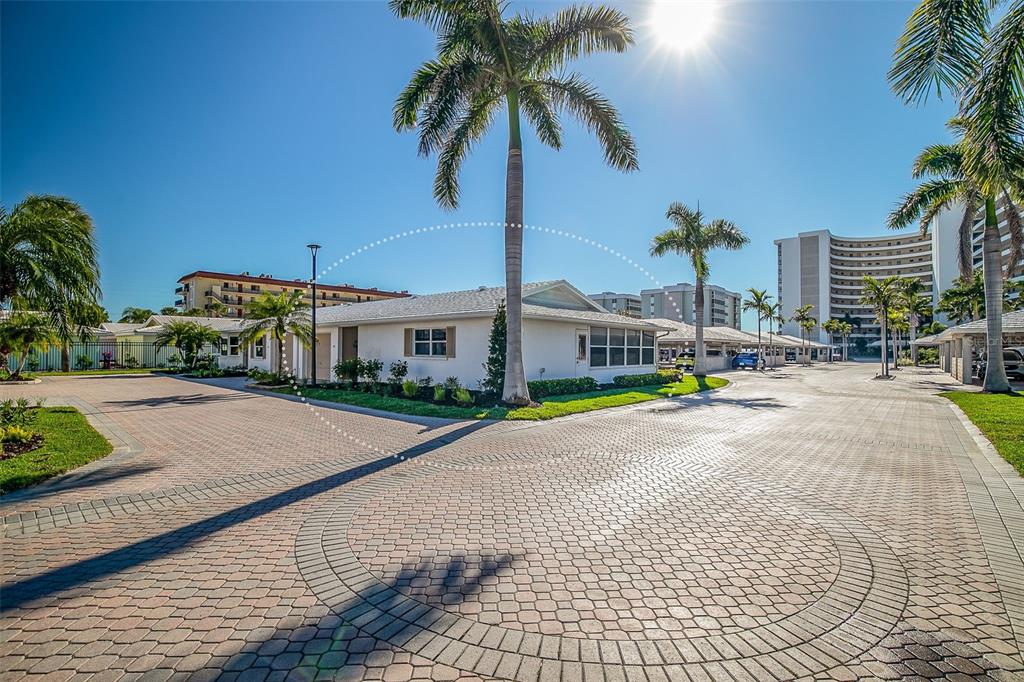 6300 Midnight Pass Road, Unit 21 Sarasota, FL 34242 - Photo 1 of 30 a front view of multiple houses with palm trees