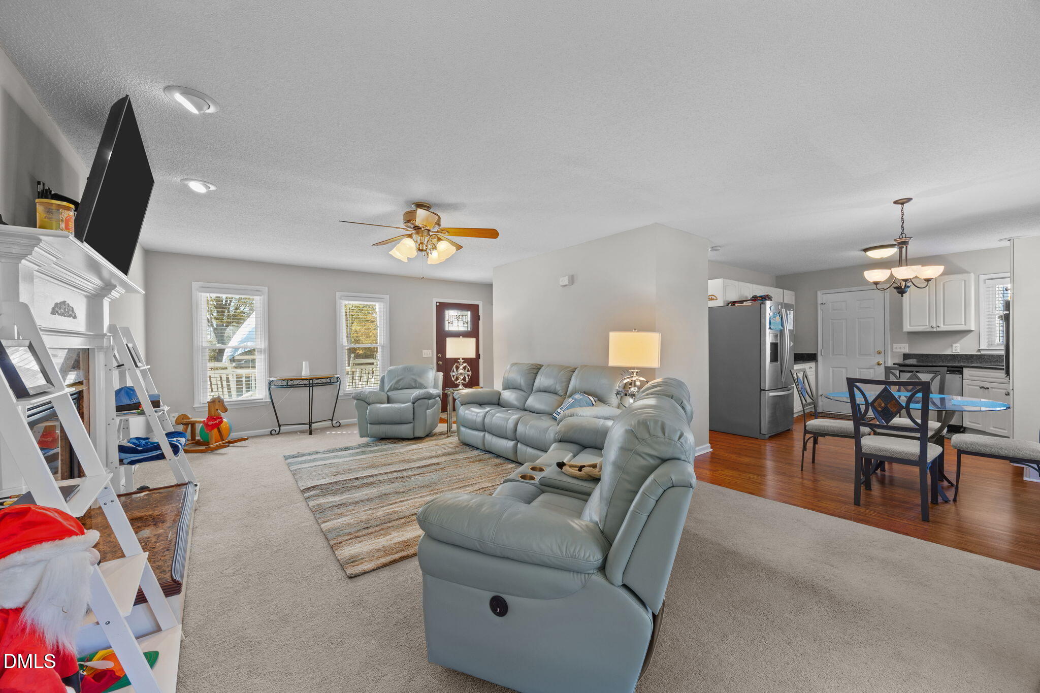 30 Stockton Drive Angier, NC 27501 - Photo 13 of 52 a living room with furniture and a flat screen tv
