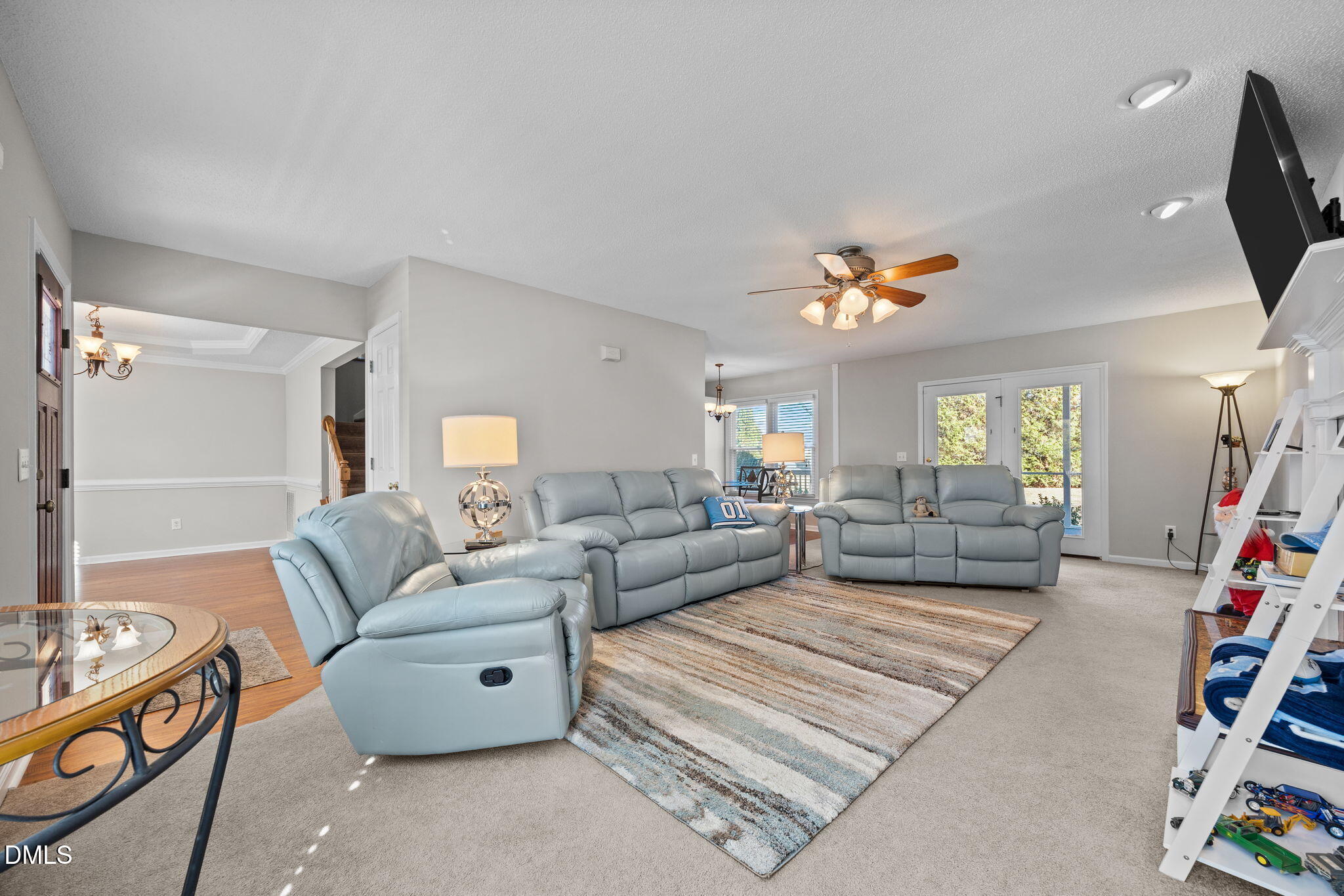 30 Stockton Drive Angier, NC 27501 - Photo 14 of 52 a living room with furniture and a flat screen tv