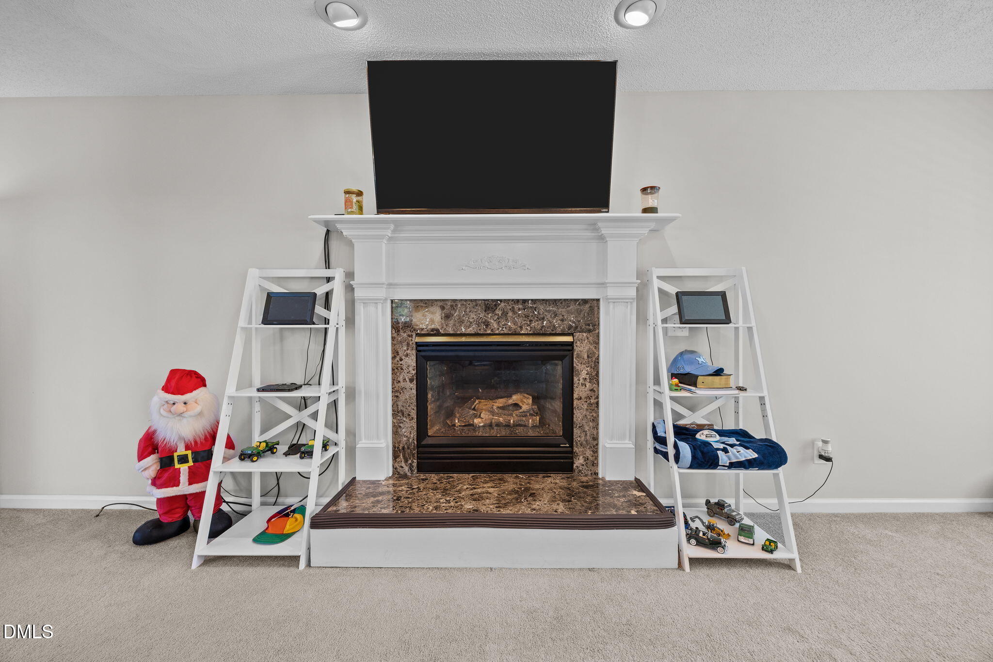 30 Stockton Drive Angier, NC 27501 - Photo 15 of 52 a living room with furniture a fireplace and flat screen tv