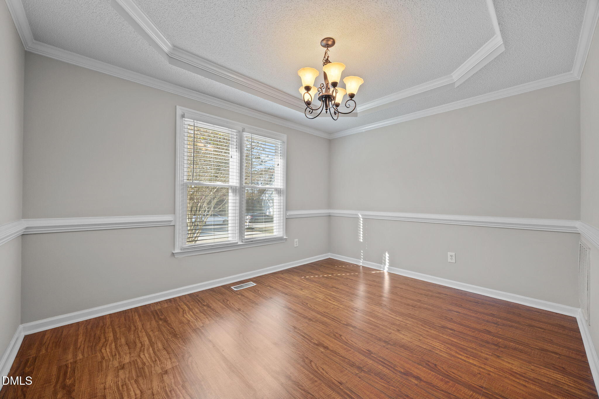 30 Stockton Drive Angier, NC 27501 - Photo 16 of 52 a view of an empty room with wooden floor and a window