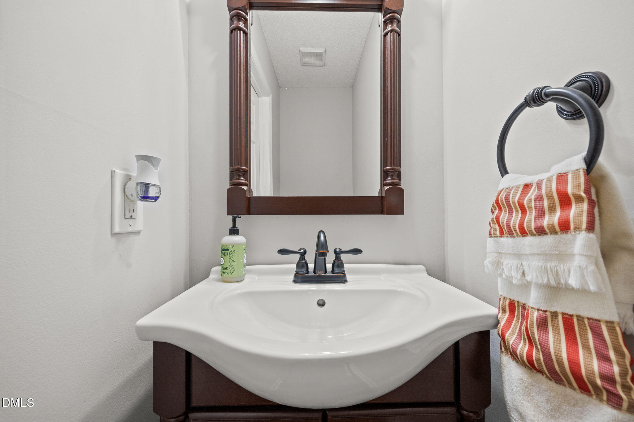30 Stockton Drive Angier, NC 27501 - Photo 25 of 52 a bathroom with a sink and a mirror