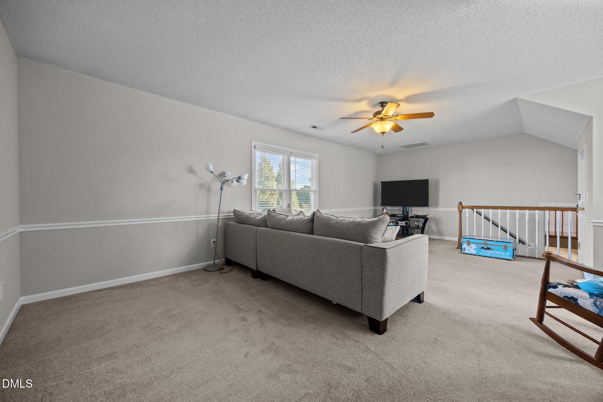 30 Stockton Drive Angier, NC 27501 - Photo 27 of 52 a living room with furniture and a flat screen tv