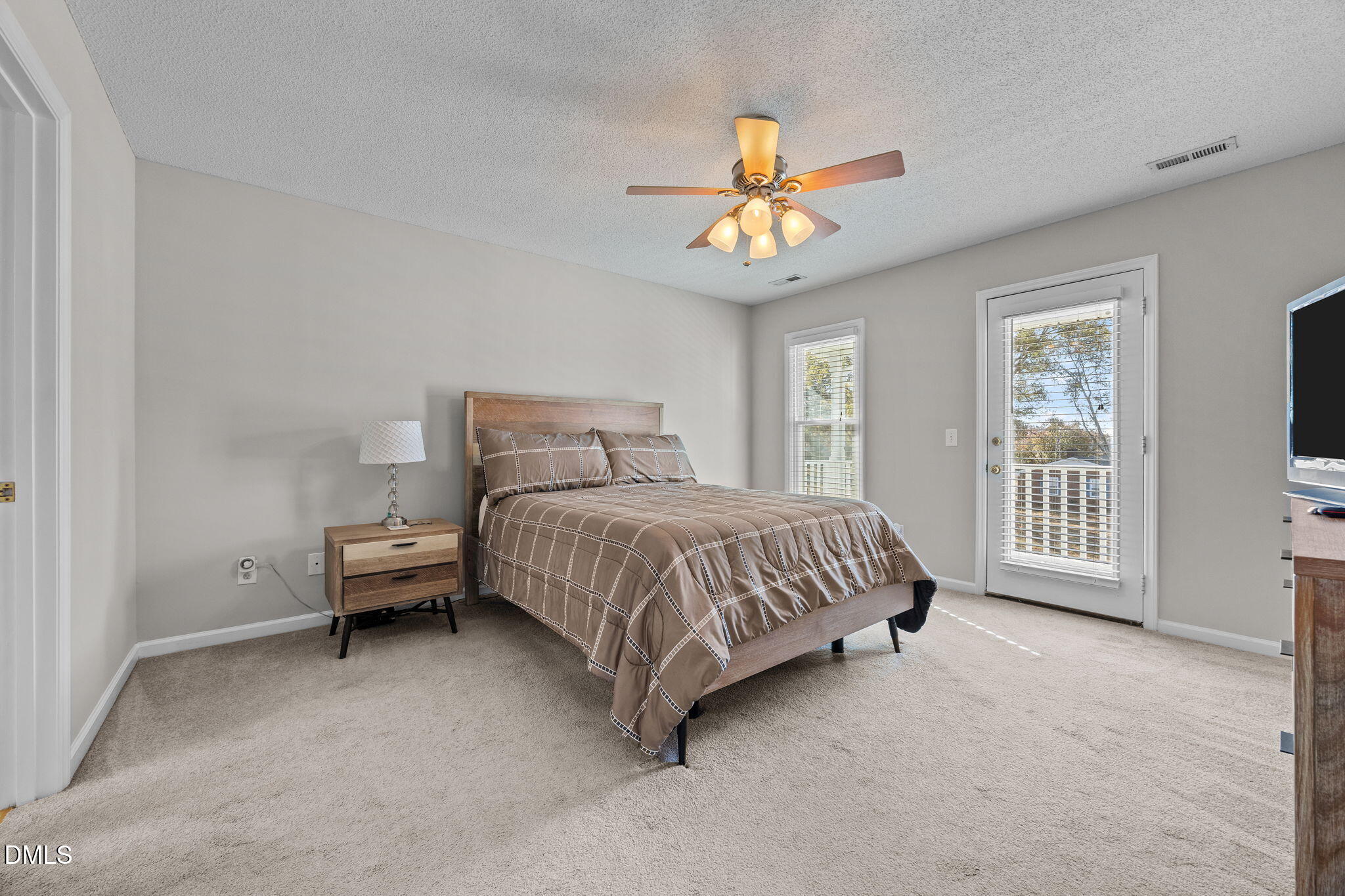 30 Stockton Drive Angier, NC 27501 - Photo 35 of 52 a bedroom with a bed and a ceiling fan